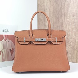 Birkin 30 in golden brown with a silver buckle- Togo leatherr-
Fully hand-stitched with gold-plated hardware engraved in steel font-100% Handmade, needs 3-7 days